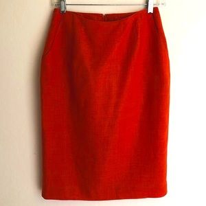 Orange linen fully lined short skirt w/back pleat.